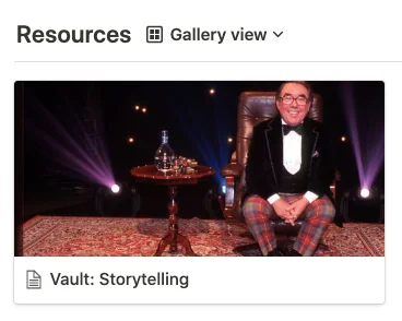 Notion gallery view of a Resources page with a card titled Vault: Storytelling showing a man in a bow tie seated on a stage