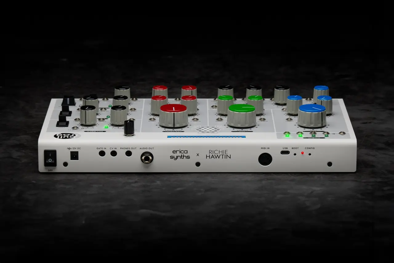 Rear view of a white synthesizer labeled Erica Synths x Richie Hawtin with red, green and blue knobs