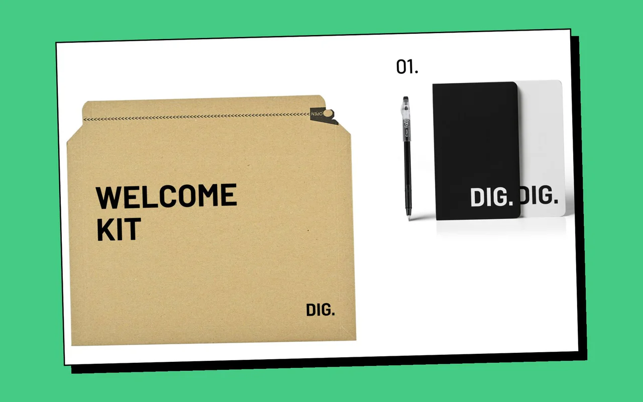 A kraft envelope printed Welcome Kit beside a pen and two black DIG notebooks, on a green background.